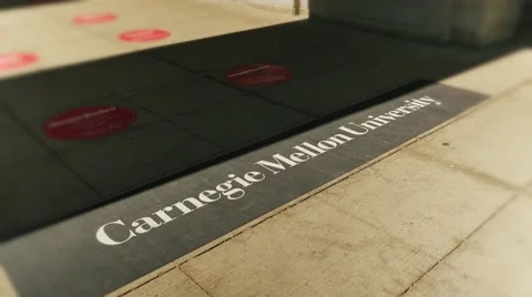 Students Walk on the Campus Sidewalks at Carnegie Mellon University Stock Footage