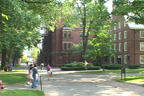 Students walk in front of a Harvard classroom building. Stock Footage 551126