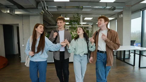 Students walking and talking in modern school hallway Stock Footage 313248088