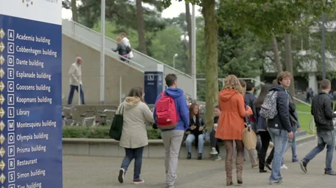 Students walking around on campus Stock Footage 41434338