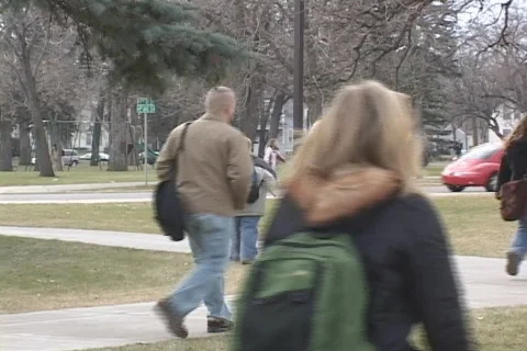 Students walking on campus Stock Footage 548977