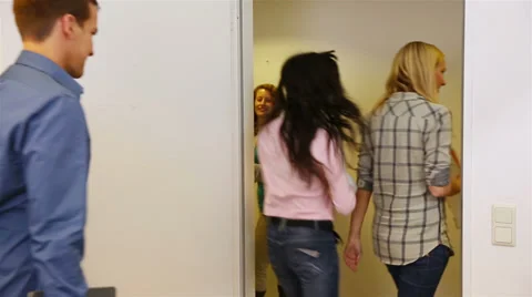 Students walking from classroom to hallway Stock Footage 32818869