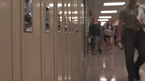 Students walking down hall by lockers (3 of 16) Stock Footage 50416977