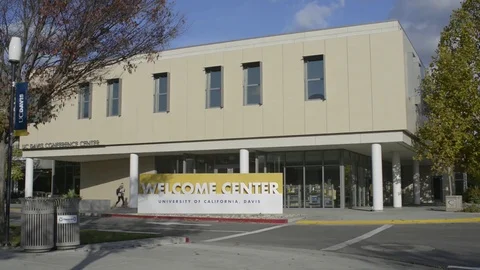 Students walking out of the UC Davis Welcome Center Stock Footage 72506498