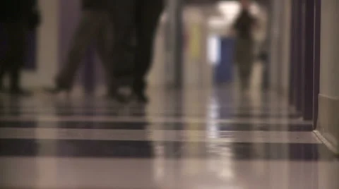 Students walking in school hallway Stock Footage 1077504