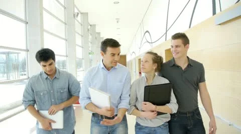Students walking with teacher in school building Stock Footage 14826833