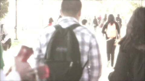 Students walking through campus Stock Footage