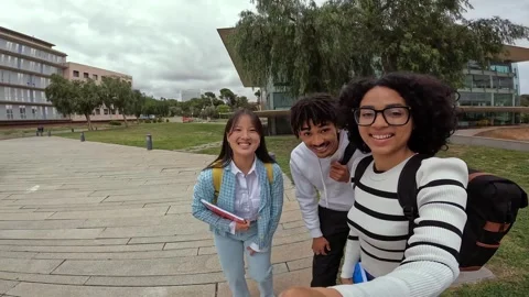 Students waving while recording a video with a wearable camera Stock Footage 275021322