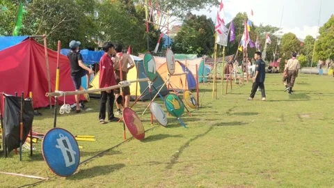 Students who are camping in the open yard during a scout event Stock Footage 282708177