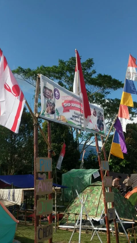 Students who are camping in the open yard during a scout event Stock Footage 282708194