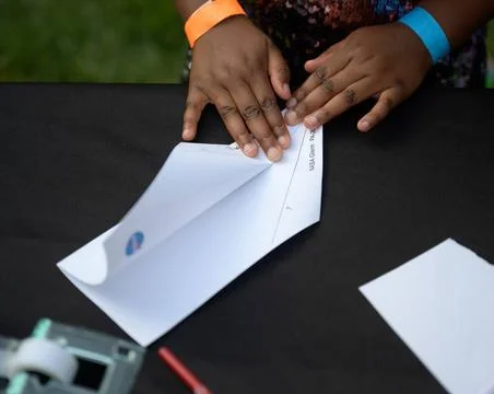 Students work an airplane building hands-on STEM activity on the grounds o... Stock Photos