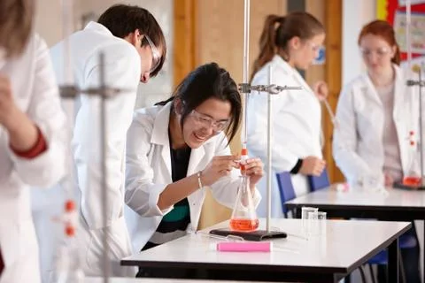 Students working in chemistry lab Stock Photos