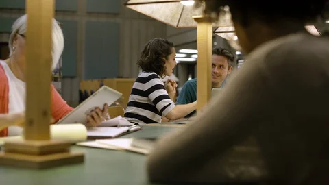 Students working in college library. Stock Footage 88016459