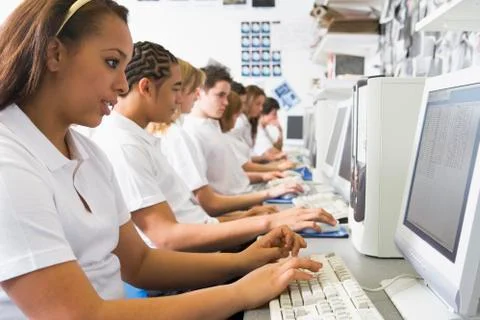 Students working on computer workstations Stock Photos
