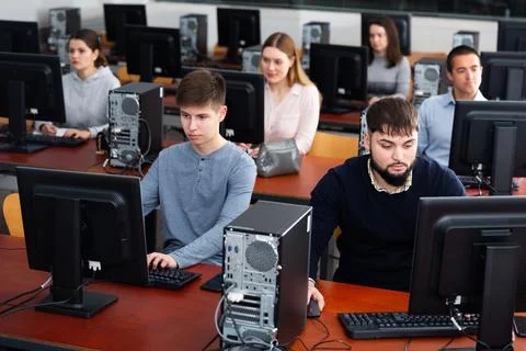 Students working on computers in classroom 写真素材
