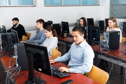 Students working on computers in classroom 写真素材