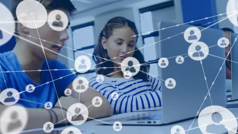 Students working at laptop in classroom noticing network node emerging then Stock Footage 315536559