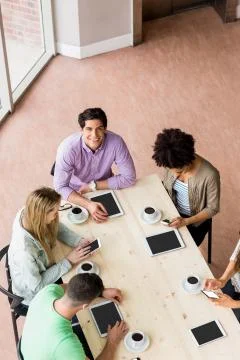 Students working together on an assignment Stock Photos