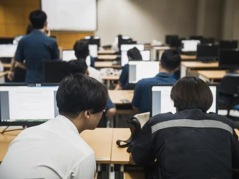 Students working together in computer room during lecture class seminar Stock Photos