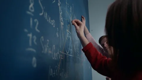 Students write on the Board of mathematical formulas, talk, discuss Video stock 119327021