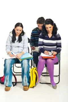 Students writing at course Stock Photos