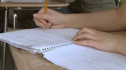 Students writing in their notebook in classroom (2 of 3) Stock Footage 10330823