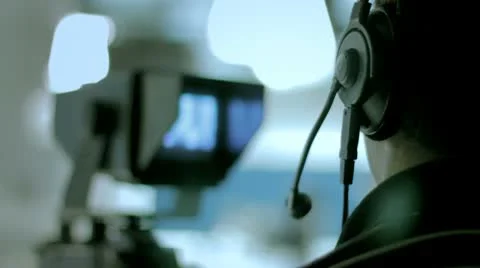 Studio 4 - A camera operator behind the camera in a television studio Stock Footage 10771133