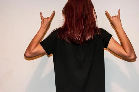 A studio back view close-up shot of an unrecognizable young Caucasian redhead Stock Photos