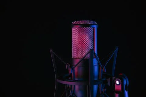 Studio black condenser microphone on black background Stock Photos