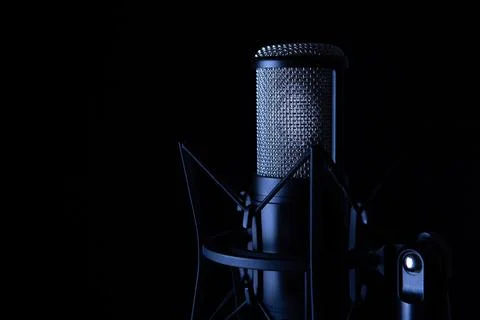Studio black condenser microphone on black background Stock Photos