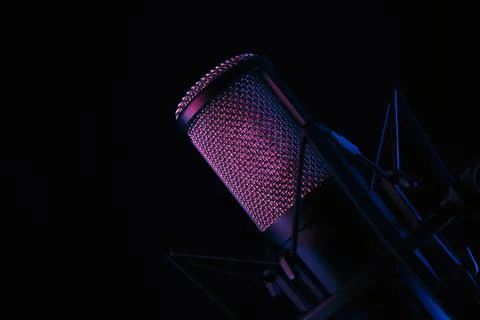 Studio black condenser microphone on black background Stock Photos