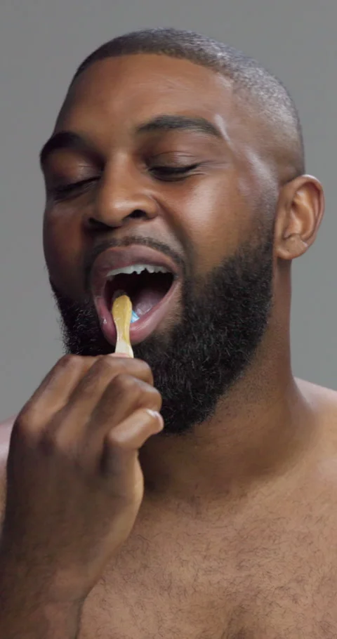Studio, black man and face with toothbrush for dental, cleaning and oral care Stock Footage 308689174
