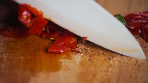 Studio close up shot of chili cutting with a big blade,hot red jalapeno on Stock-Footage 73670512