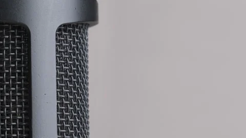Studio Condenser Microphone Rotates on Gray Background with Place for Text Stock Footage 146083084
