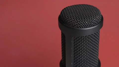 Studio Condenser Microphone Rotates on Red Background with Place for Text Stock Footage 146064081