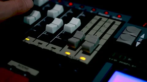 Studio Console with Faders Buttons and Blue Screen Display Stock Footage 340243100