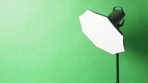 Studio flash light on green screen backround. Stock Photos