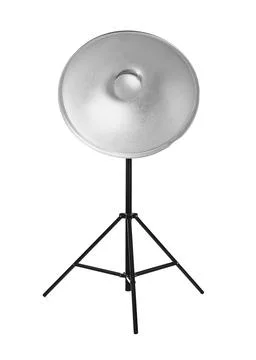 Studio flash light with reflector on tripod against white background. Profess Stock Photos