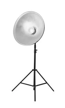 Studio flash light with reflector on tripod against white background. Profess Stock Photos