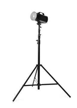 Studio flash light on tripod against white background. Professional photograp Stock Photos