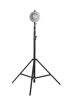 Studio flash light on tripod against white background. Professional photograp Stock Photos