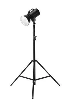 Studio flash light on tripod against white background. Professional photograp Stock Photos