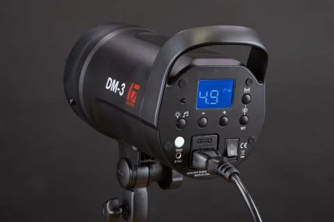 Studio flash lighting on black background. Jinbei Stock Photos