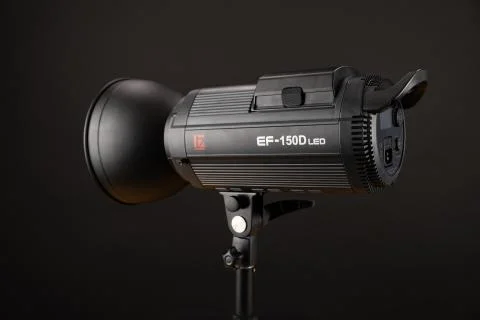 Studio flash lighting on black background. Jinbei Stock Photos