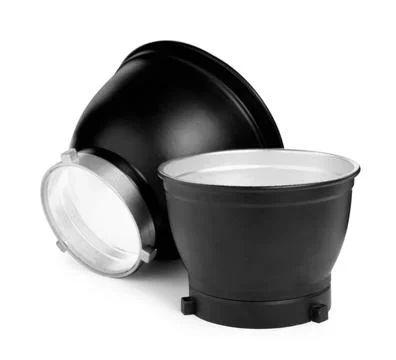 Studio flash lights reflectors on white background. Professional photographer Stock Photos