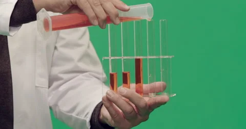 Studio, green screen, close-up of test tubes being filled, London, UK Stock Footage 139894475