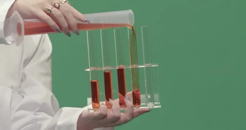 Studio, green screen, a close-up of test tubes being filled, London, UK Stock Footage 139895127