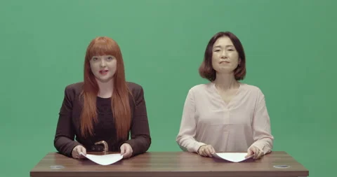 Studio, green screen, two female presenters at a vintage desk, London, UK Stock Footage 139886616