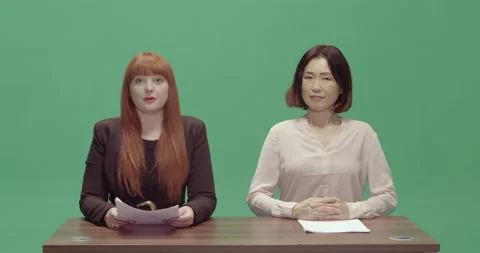 Studio, green screen, two female presenters at a vintage desk, London, UK Video stock 139886722