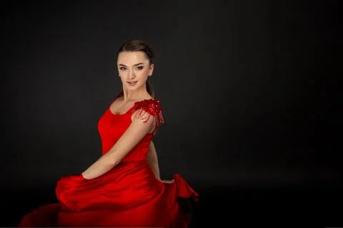 Studio half length portrait of beautiful girl in red dress Stock Photos